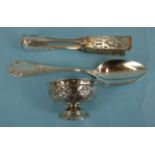 A pair of white metal asparagus tongs stamped 900 POSFN, a German spoon and a small embossed bowl