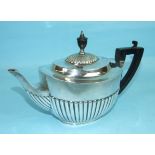 An oval silver teapot of half-gadrooned form with ebony handle and finial, London 1899 ___18.5oz