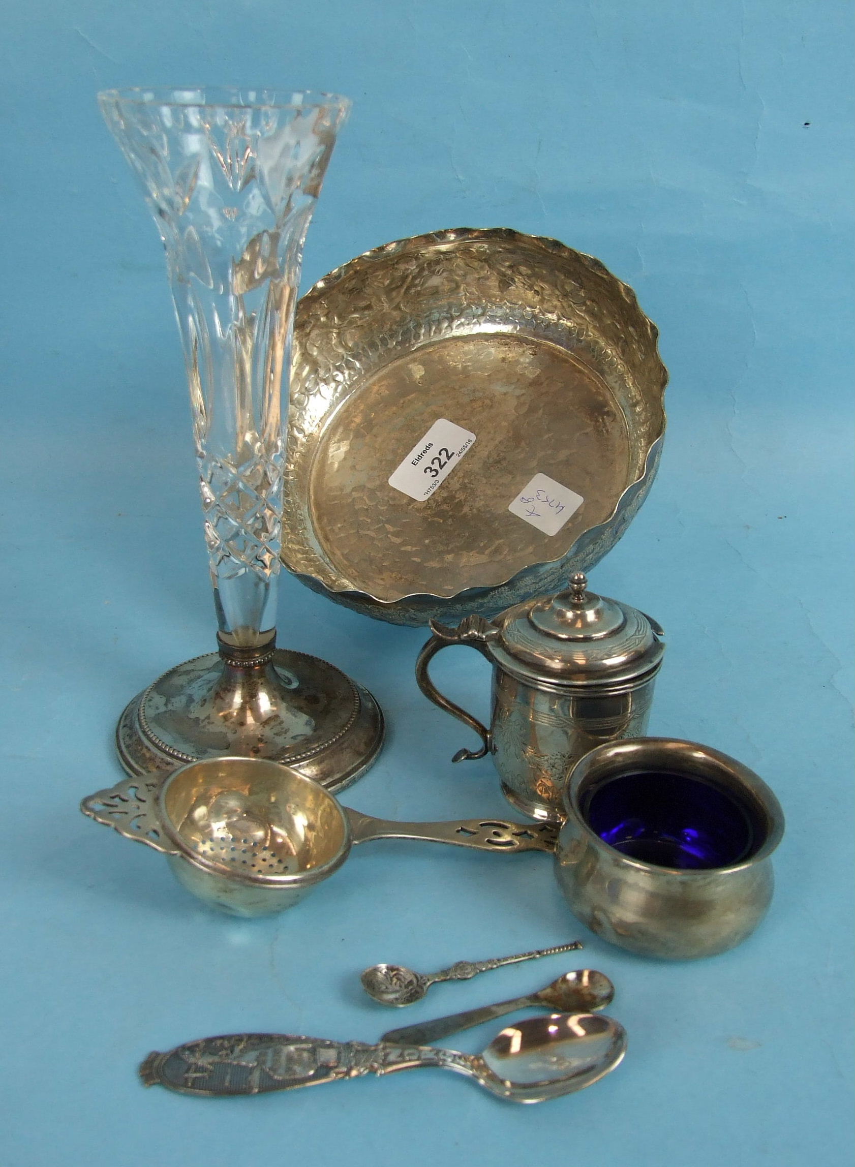 A silver tea strainer with pierced decoration and matching drip bowl, Birmingham 1936, a silver