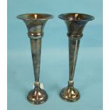 Two similar silver spill vases with knopped stems, 23cm high, London 1926, (loaded), (one a/f).