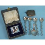 A Georgian silver caddy spoon with shell bowl, maker EM, London 1804, a cased silver napkin ring,
