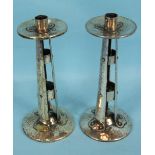 A pair of Arts-and-Crafts-style hammered copper and plated candlesticks of open riveted strap