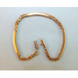 A 9ct gold bracelet of curved batons and fancy links, 9g.