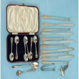 A cased set of six silver teaspoons with shell terminals, Sheffield 1925, six silver tea forks and