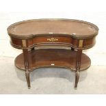 A 19th century French two-tier gallery top mahogany butler's table, the kidney-shaped top with