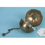 A Victorian silver tea infuser of spherical form, Birmingham 1895, 5.5cm diameter.