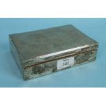 A rectangular silver cigarette box with engine turned engraving, Birmingham 1959, 16.5 x 11 x 4cm.