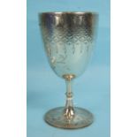 A Victorian trophy cup of goblet form with knopped stem and engraved decoration, initials and crest,