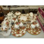 Sixty pieces of Royal Albert 'Old Country Roses' teaware, coffeeware and dinnerware.