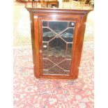 A 19th century mahogany corner wall cupboard fitted with astragal-glazed door, 77.5cm wide, 103.