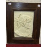 G Barnsmith, a bronzed plaster plaque bust of a young woman, signed and dated, 1806, 39.5 x 28cm.