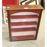 A stained mahogany wall cabinet fitted with a hinged glazed door, 51cm high, 42.3cm wide, 11cm