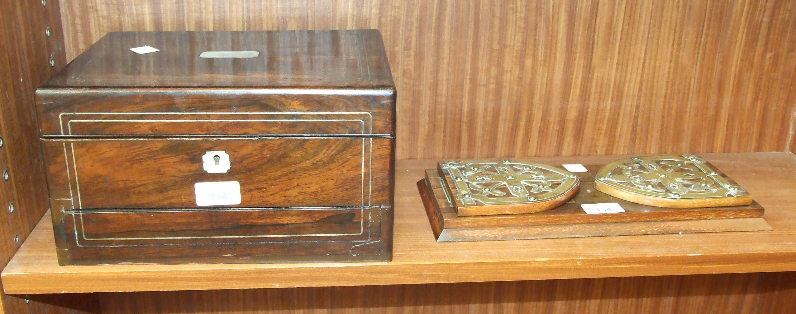 A rosewood jewellery box fitted with 'secret' drawer, (inner tray lacking), 30cm wide, 16cm high, (
