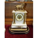 A marble-cased mantel timepiece surrounded with gilt metal lion, applied gilt metal pillasters and