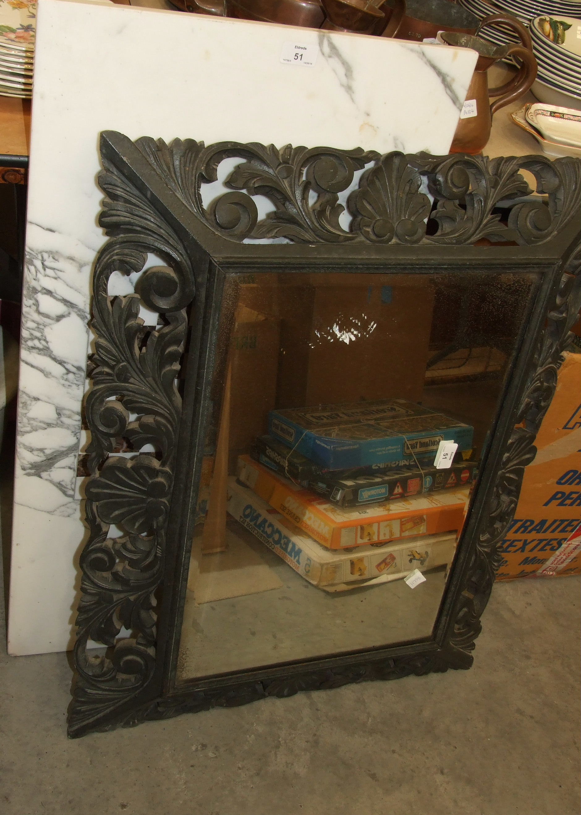 A carved ebonised-frame rectangular wall mirror, 64 x 84cm overall, one other mirror and a marble