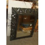 A carved ebonised-frame rectangular wall mirror, 64 x 84cm overall, one other mirror and a marble