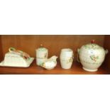 Five pieces of A J Wilkinson Royal Staffordshire pottery with relief-moulded fruit decoration on a