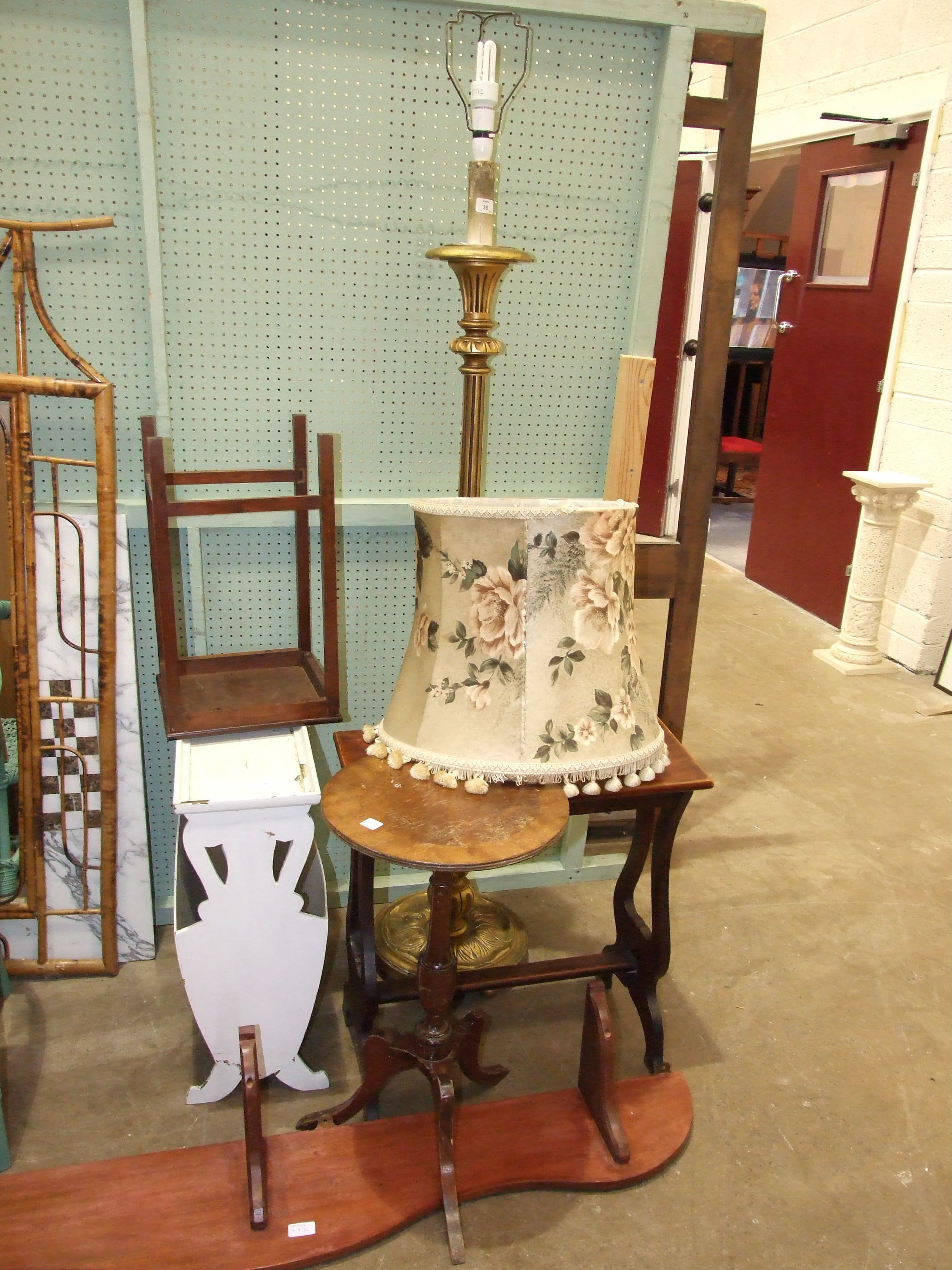 A gilt wood standard lamp with turned and reeded column on circular base, a stained wood organ stool