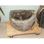 A granite 'D'-shaped garden trough, 55cm wide, 24cm high, 49cm deep.