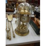 A German gilt metal 400-day timepiece of typical pillared dome form, under glass dome, 43cm