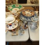 A Real Stone China joint carving dish with gravy reservoir, decorated with blue and white prunus