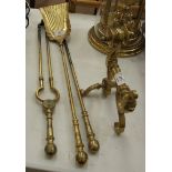 A set of three fire brasses and a brass andiron, (4).