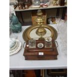 An oak pen and ink stand fitted with a drawer, 30cm wide, a brass Benares tray, oil lamp, circular