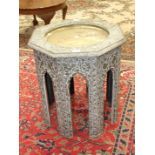 A Middle Eastern painted wood octagonal occasional table, the top with central inset brass tray,