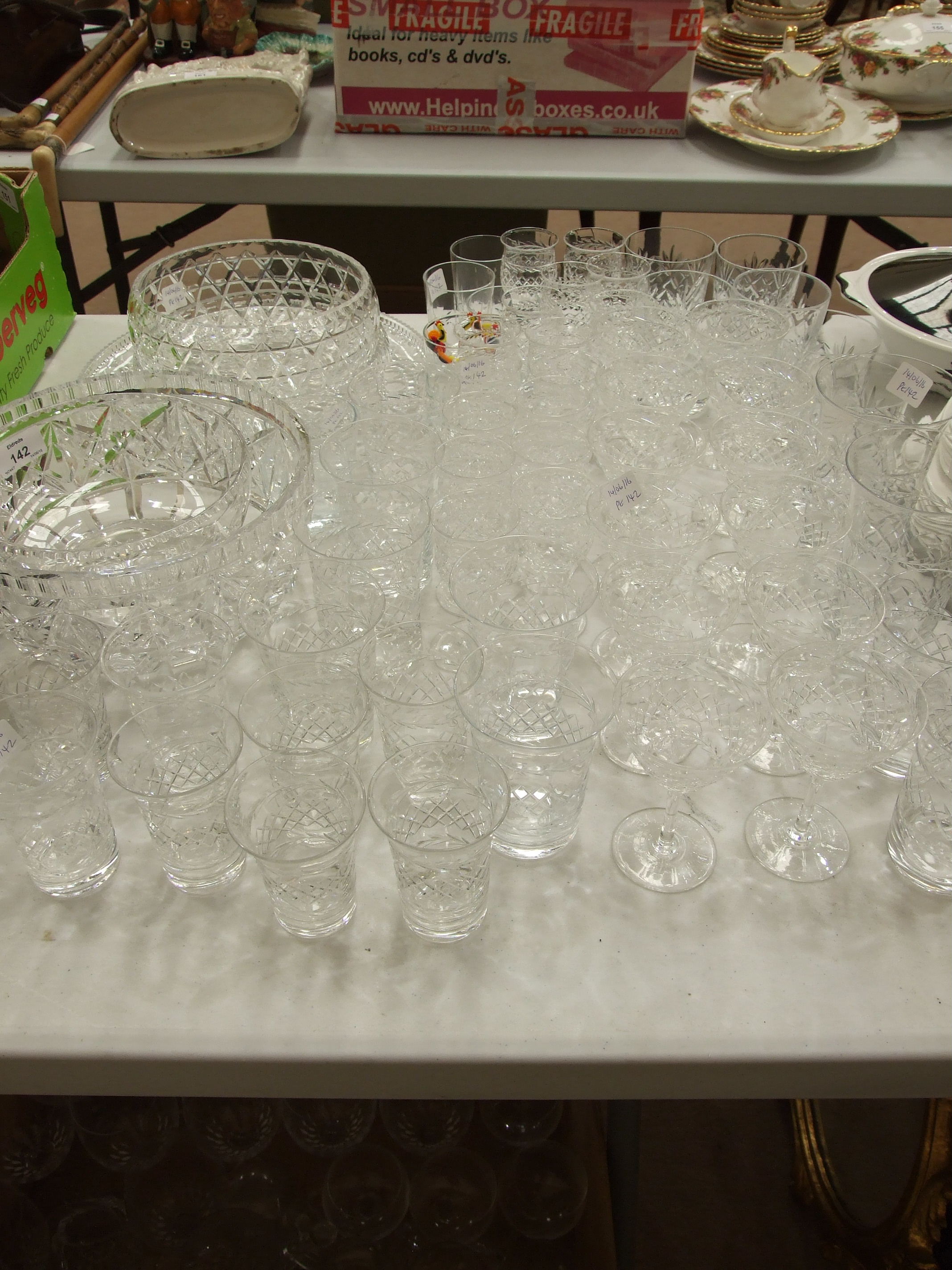 A collection of wine and drinking glasses, three glass bowls, etc.