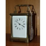 A 20th century French brass carriage timepiece with white enamel dial, (a/f), 14cm overall.