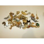 A quantity of paste brooches in the form of dogs, horses, cats, etc, (approximately 38).
