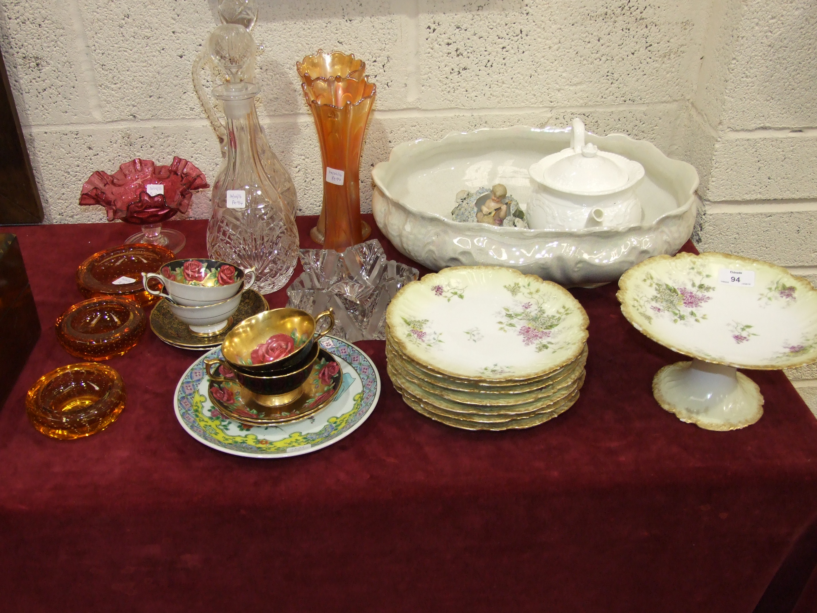 A cut glass jug and stopper, 36cm high, a glass decanter, a cranberry glass dish with wavy rim on - Image 2 of 2