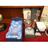 Three Waterford Crystal decanters, 27cm, 31cm and 32cm, in original boxes, a boxed Waterford Crystal