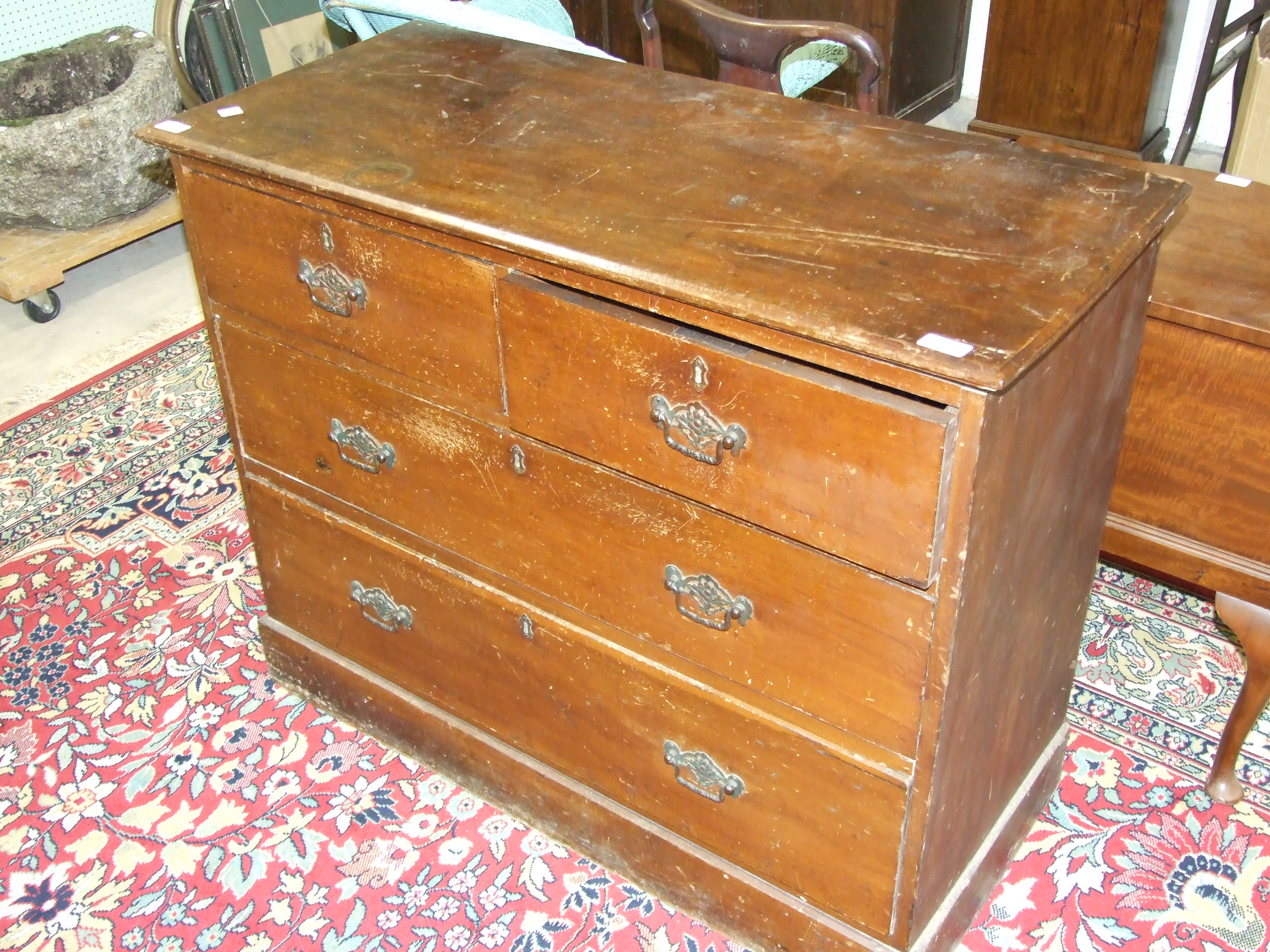 A 19th century stained wood rectangular chest of two short and two long drawers, on plinth base (