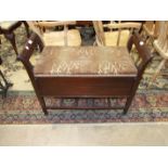 An early-20th century duet stool with hinged padded seat, on square tapering legs, 88cm.