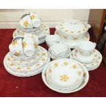 Fifty-eight pieces of Alfred Meakin 'Glo-White' floral-decorated teaware and dinnerware.