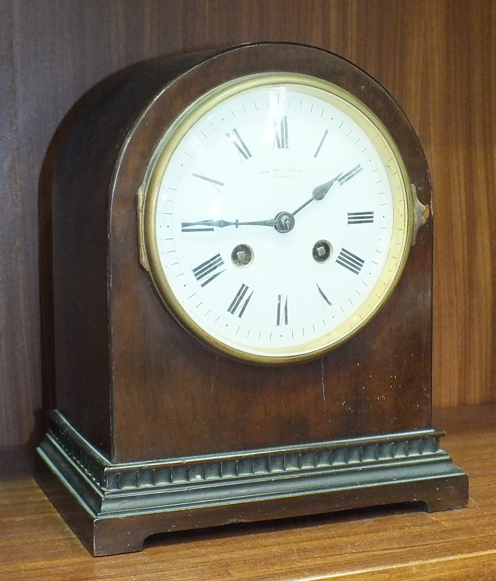 A mahogany striking mantel clock with dome-shaped case, the movement stamped 'Medaille D'Or, Paris