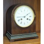 A mahogany striking mantel clock with dome-shaped case, the movement stamped 'Medaille D'Or, Paris