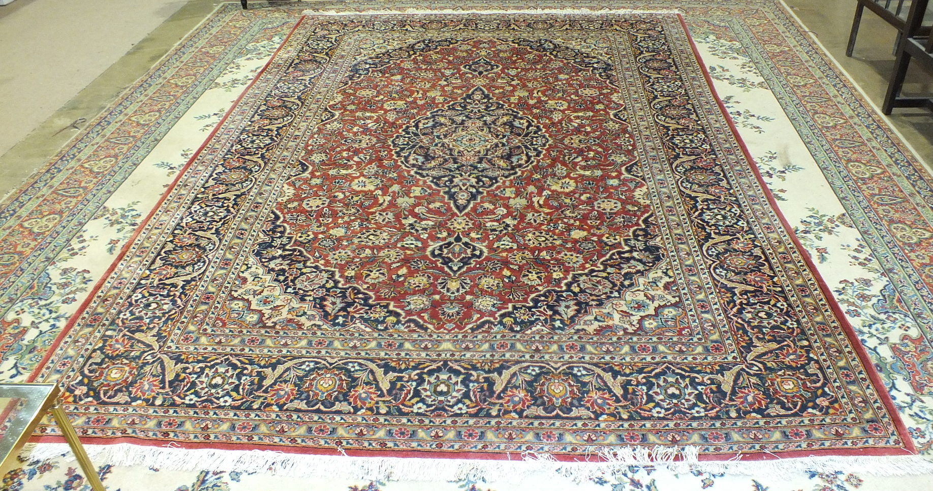 A large floral-decorated wool rug, 290 x 332cm.