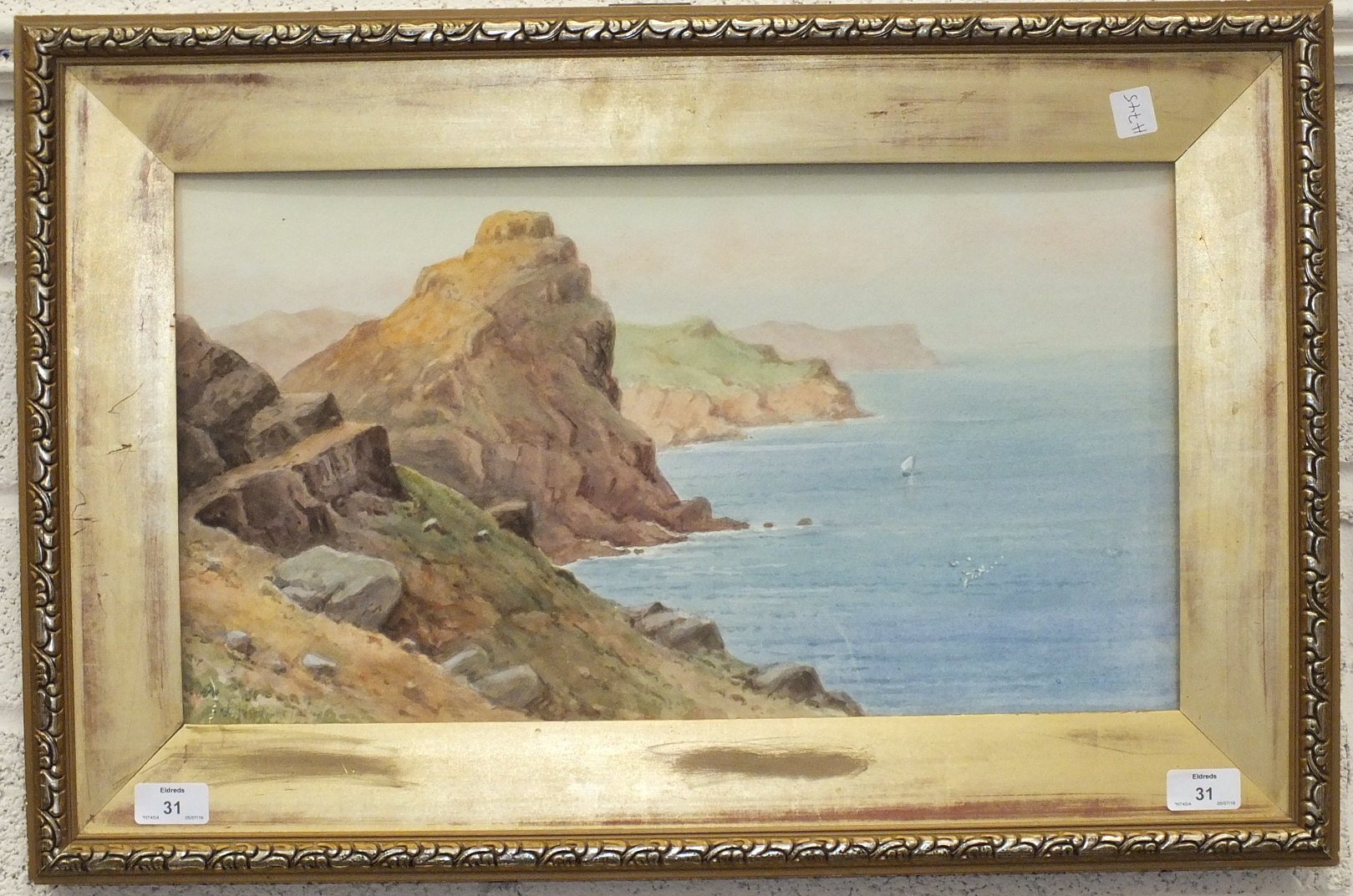 Lewis Mortimer, 'Castle Rock on the North Devon Coast', a signed watercolour, 28 x 51cm.