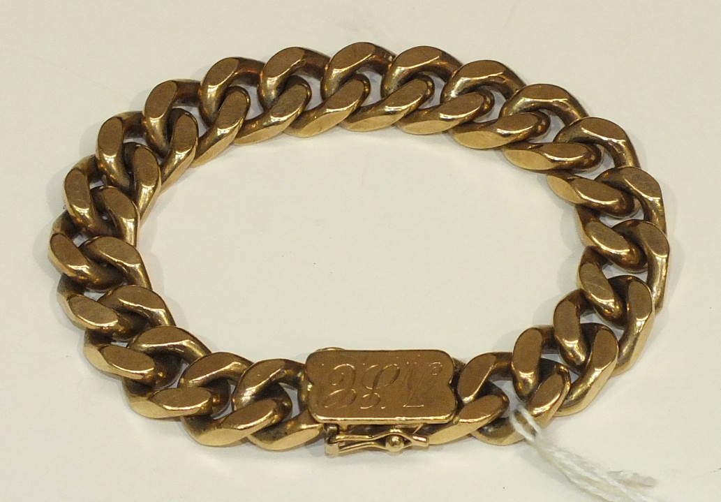 A 9ct gold bracelet of curb links with concealed clasp, 95.9g.