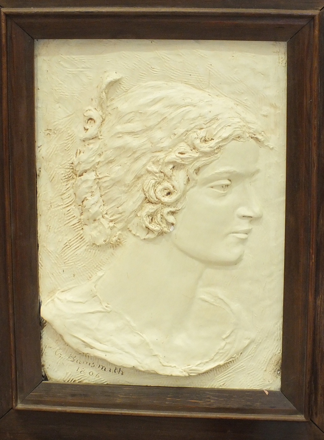 G Barnsmith, a bronzed plaster plaque bust of a young woman, signed and dated, 1806, 39.5 x 28cm.