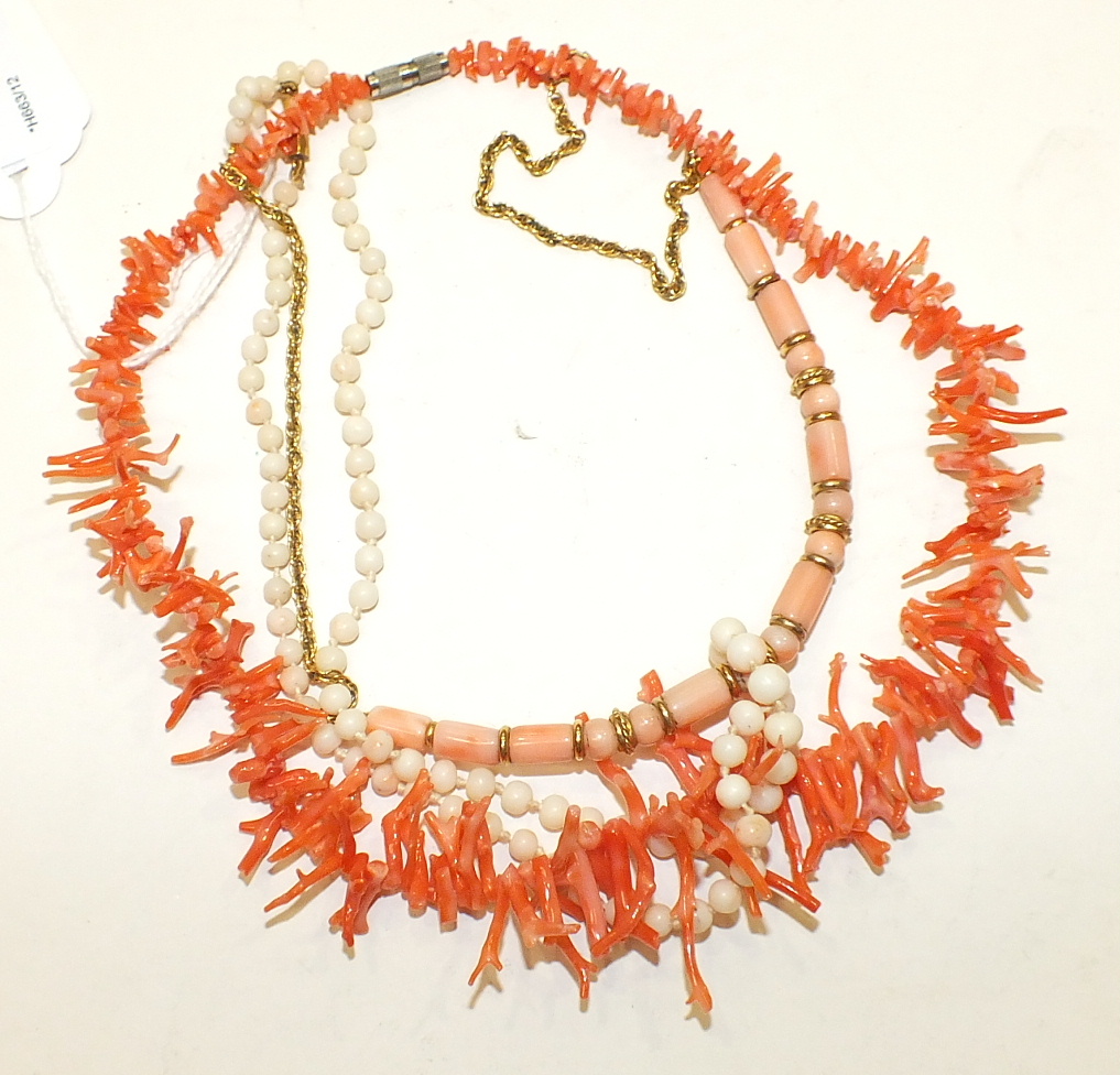 A pink twig coral necklace, 41cm long, a pale pink/white coral bead necklace, 49cm and a necklace of