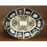 A Royal Crown Derby Imari-decorated oval shallow two-handled dish, factory and date marks for