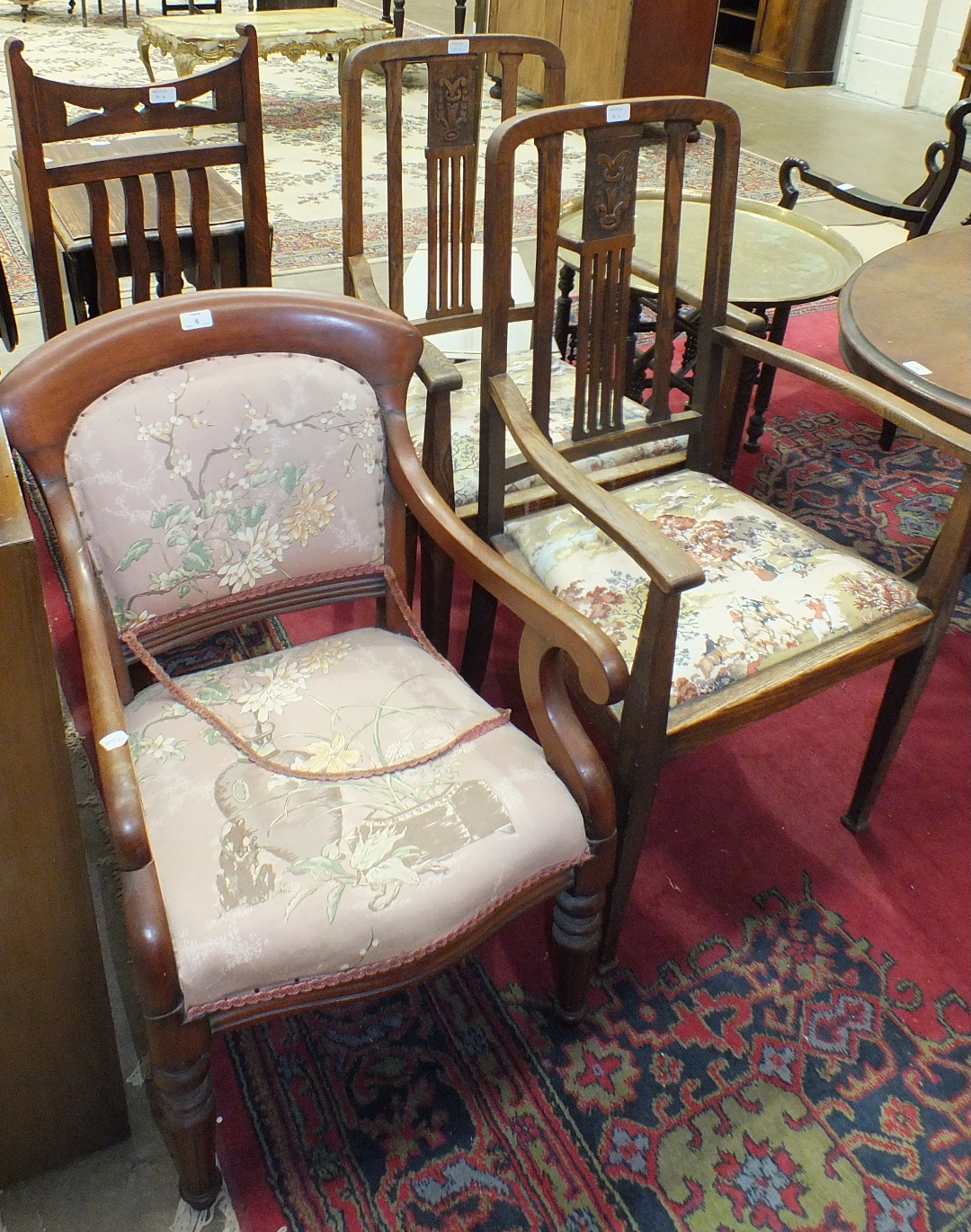 A late-19th century mahogany-framed upholstered-back-and-seat elbow chair on turned and fluted front