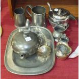 A silver tea strainer, Birmingham 1944, a pewter meat plate, 31 x 24cm, a pewter tankard stamped '