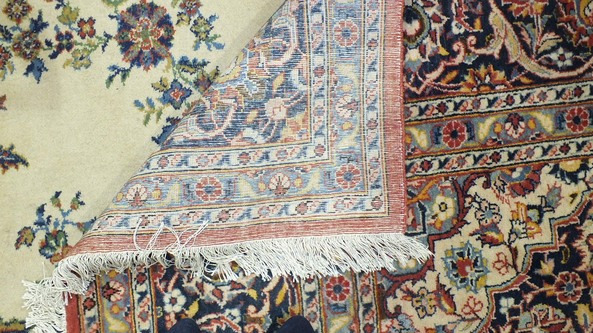 A large floral-decorated wool rug, 290 x 332cm. - Image 2 of 2