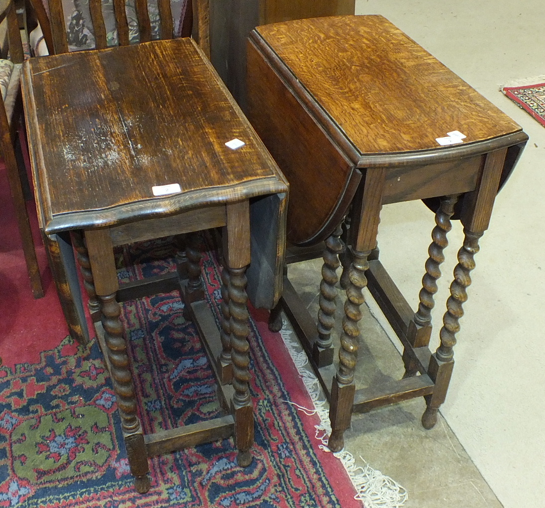 A small oak drop-leaf table on barley-twist legs, 76.5 x 59.5cm open and another similar table, (