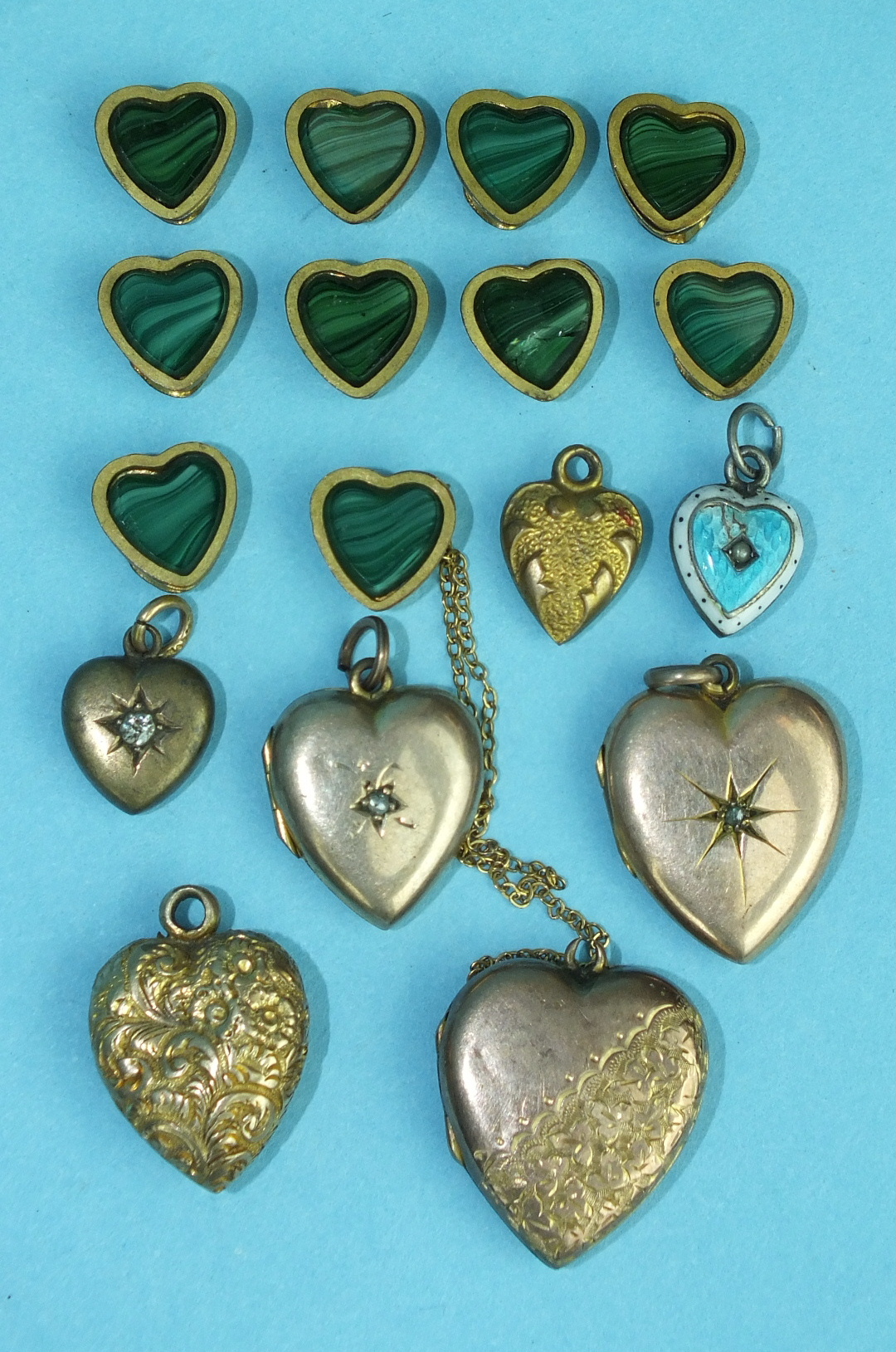 Ten small gilt metal and malachite sliders of heart shape and seven various heart-shaped lockets and