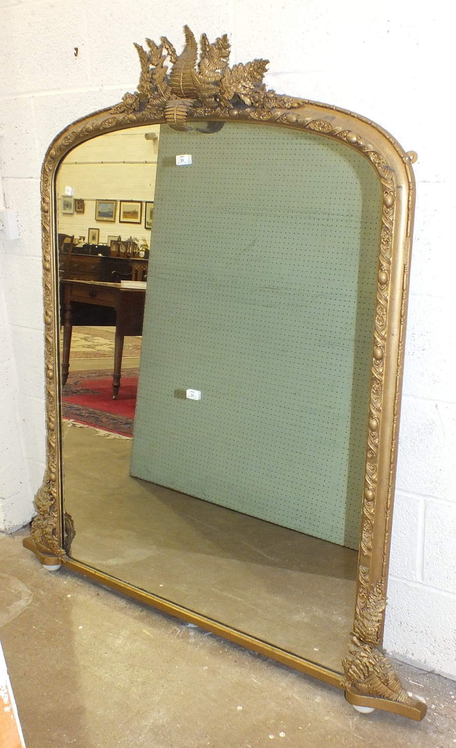 A Victorian gilt gesso overmantel mirror, the frame applied with fern leaves, 111cm x 150cm high.